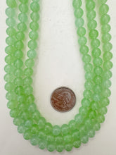 color enhanced quartz: bright pale green, 8mm round, 15" strand, sold per strand