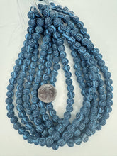pale blue black , carved design buddha motif, large hole, vintage look acrylic, 10mm round, 15" strand, sold per strand