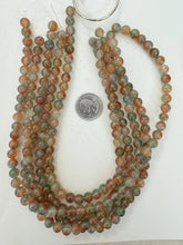 color enhanced quartz: orange green, 8mm round, 15" strand, sold per strand