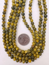 color enhanced serpentine: yellow, 6mm round, 15" strand, sold per strand