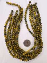 color enhanced serpentine: yellow, 6mm round, 15" strand, sold per strand