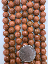 goldstone, 10mm faceted round, 14" strand, SOLD PER STRAND