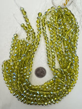 dark lime green, blue ab coated, glass, 8x7mm fancy cut faceted rondelle, 15" strand, sold per strand
