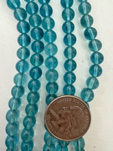 color enhanced quartz: dark pale electric blue, 7mm round, 13.5" strand,  SOLD PER STRAND