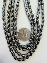 hematite, 8x5mm bowed tube, 15" strand, sold per strand