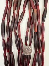 red horn, 34-52mm random assortment tube, 15" strand, sold per strand,
