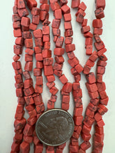 color enhanced howlite: pale red, 10mm off center drilled cube mix , 30" strand,  SOLD PER STRAND