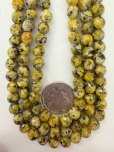 color enhanced serpentine: yellow, 8mm faceted round, 15" strand, sold per strand