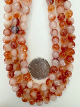 color enhanced quartz: red orange of white, 8mm faceted round, 15" strand, sold per strand