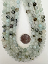 color enhanced rutilated quartz: pale aqua blue, 8mm round, 15" strand, sold per strand