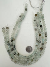 color enhanced rutilated quartz: pale aqua blue, 8mm round, 15" strand, sold per strand