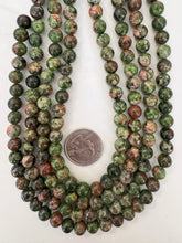 color enhanced serpentine: green peach orange , 8mm round, 15" strand, sold per strand