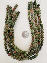 color enhanced serpentine: green peach orange , 8mm round, 15" strand, sold per strand