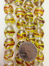 clear red orange yellow, swirl motif, vintage stock glass, 16x14mm barrel, 6" strand, SOLD PER STRAND