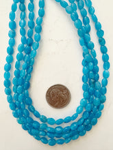 color enhanced quartz: electric blue, 8x6x4mm oval, 15" strand, sold per strand