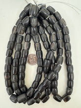 black faint off white, faux bone motif, vintage look resin, 14x12mm barrel, 15" strand, sold per strand