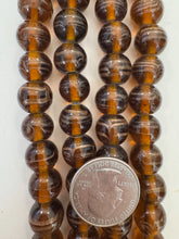 root beer brown copper, swirl motif, vintage stock glass, 13mm round, 6" strand, SOLD PER STRAND