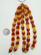 red yellow, two tone motif, vintage stock glass, 19x12x8mm oval, 6" strand, SOLD PER STRAND