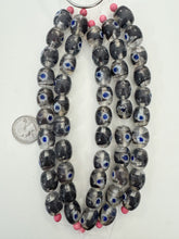 clear very dark purple white blue, dot swirl motif, vintage stock glass, 17x14mm barrel, 6" strand, SOLD PER STRAND