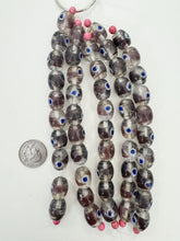 clear dark purple white blue, dot swirl motif, vintage stock glass, 17x14mm barrel, 6" strand, SOLD PER STRAND
