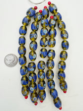 dark green yellow blue white, dot swirl motif, vintage stock glass, 17x14mm barrel, 6" strand, SOLD PER STRAND