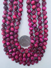 color enhanced tiger eye: magenta, 8mm round, 15" strand, sold per strand