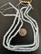 opalite glass, 6x4mm faceted rondelle, 15" strand, sold per strand