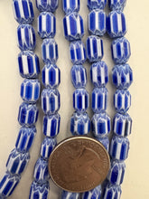 blue white, chevron motif, semi dull finish, vintage stock glass, 10x7mm barrel mix, 15" strand, SOLD PER STRAND