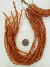 red aventurine, 11x5mm bumpy tube, 15" strand, sold per strand