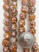 clear dark pale burnt orange green pink white, floral inside lined motif, semi dull finish, vintage stock glass, 12mm round mix, 15" strand, SOLD PER STRAND