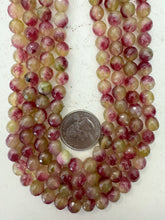 color enhanced quartz: magenta pale lime green, 8mm faceted round, 15" strand, sold per strand