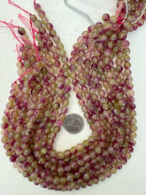 color enhanced quartz: magenta pale lime green, 8mm faceted round, 15" strand, sold per strand