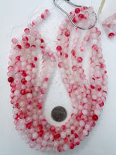 color enhanced quartz: hot pink off white, 8mm round, 15" strand, sold per strand