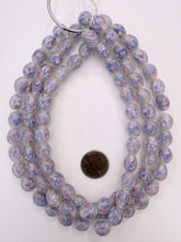 clear faint pink blue pink white, floral inside lined motif, dull finish, vintage stock glass, 14x12mm barrel mix, 15" strand, SOLD PER STRAND