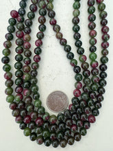 color enhanced quartz: dark green magenta, 8mm round, 15" strand, sold per strand