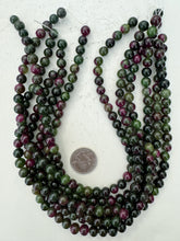 color enhanced quartz: dark green magenta, 8mm round, 15" strand, sold per strand