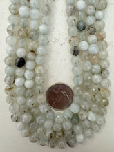 color enhanced rutilated quartz: pale blue green, 8mm faceted round, 15" strand, sold per strand