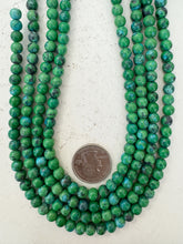 color enhanced magnesite: turquoise blue pale green, 6mm round, 15" strand, sold per strand
