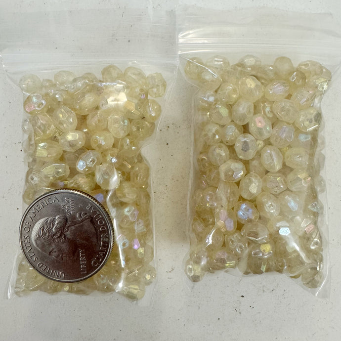 coated AB pale yellow, vintage look acrylic, 7x6mm faceted barrel,  sold per approximately 23 gram bag