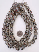 clear dark purple copper white red, dotted swirled line motif, vintage stock glass, 17x13mm barrel, 15" strand, SOLD PER STRAND