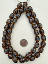 brown pale blue copper, drawn swirl motif, vintage stock glass, 20x14mm barrel,   15" strand, SOLD PER STRAND