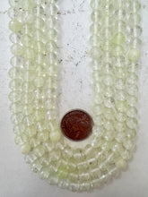 fairy glass, pale lime green,  8mm faceted round, 15" strand, sold per strand