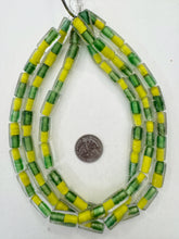 clear yellow green, two tone inside lined motif, vintage stock glass, 19x10mm tube,   15" strand, SOLD PER STRAND