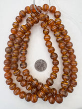 burnt orange copper orange, swirl motif, vintage stock glass, 13x12mm rondelle,  15" strand, SOLD PER STRAND