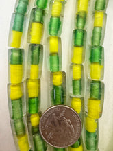 clear yellow green, two tone inside lined motif, vintage stock glass, 19x10mm tube,   15" strand, SOLD PER STRAND