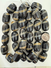 black off white golden horn, spiral motif, 32x24mm barrel tube, 15" strand, sold per strand