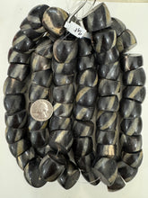 black off white golden horn, spiral motif, 26x22mm slice rondelle, 15" strand, sold per strand