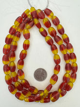 red yellow, two tone motif, vintage stock glass, 19x12x8mm oval, 15" strand, SOLD PER STRAND