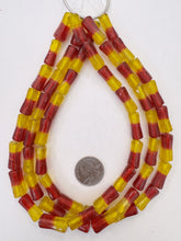 red yellow, two tone motif, vintage stock glass, 22x9mm dent tube, 15" strand, SOLD PER STRAND