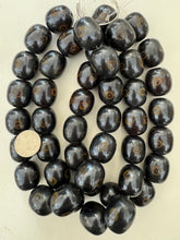 brown golden evil eye motif, faux bone, vintage look resin, 26x23mm barrel, 15" strand, sold per strand